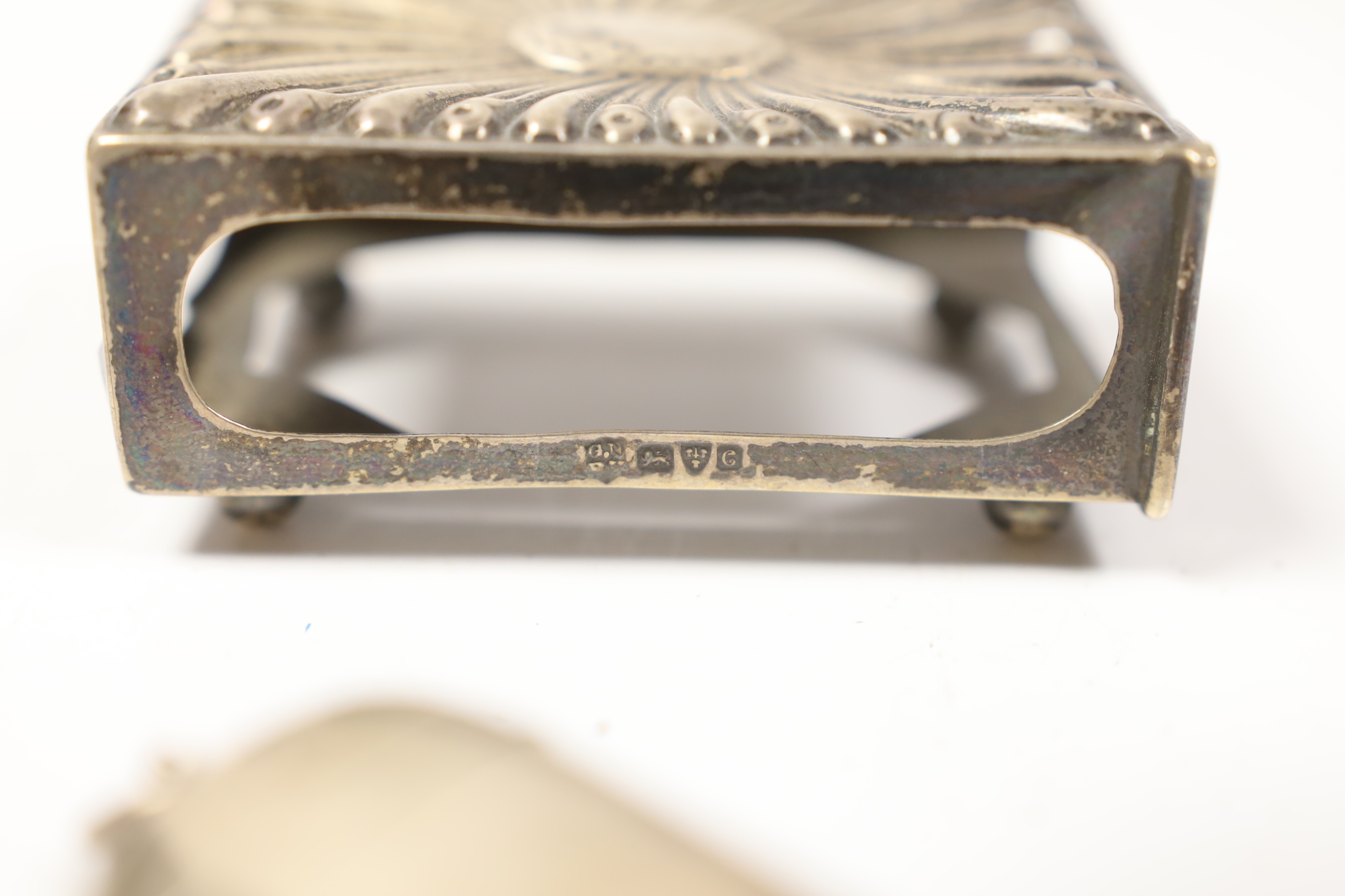 A silver vesta case, an Edwardian silver stamp case and a silver matchbox holder